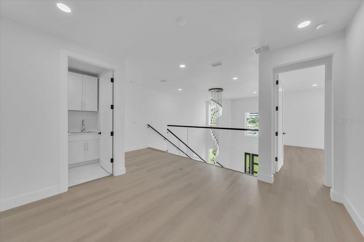 Upstairs landing, looking into laundry room on left