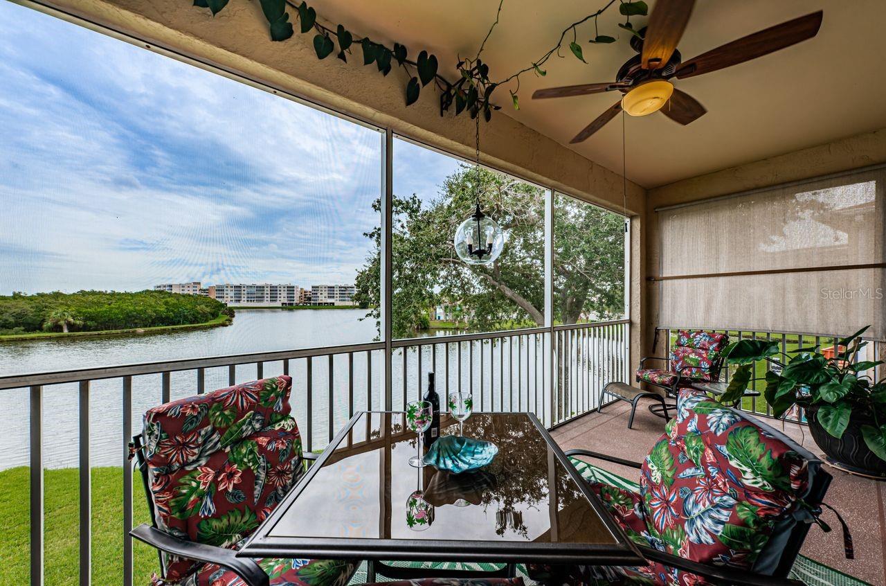 Screened balcony overlooking Snowy Egret Lake – perfect for morning coffee and birdwatching.