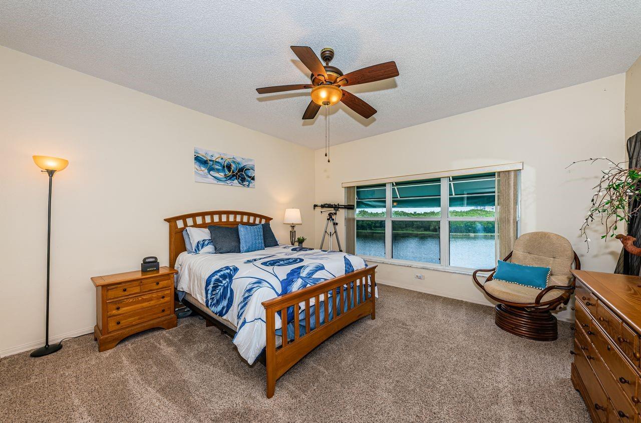 Large primary suite with water views and direct balcony access.
