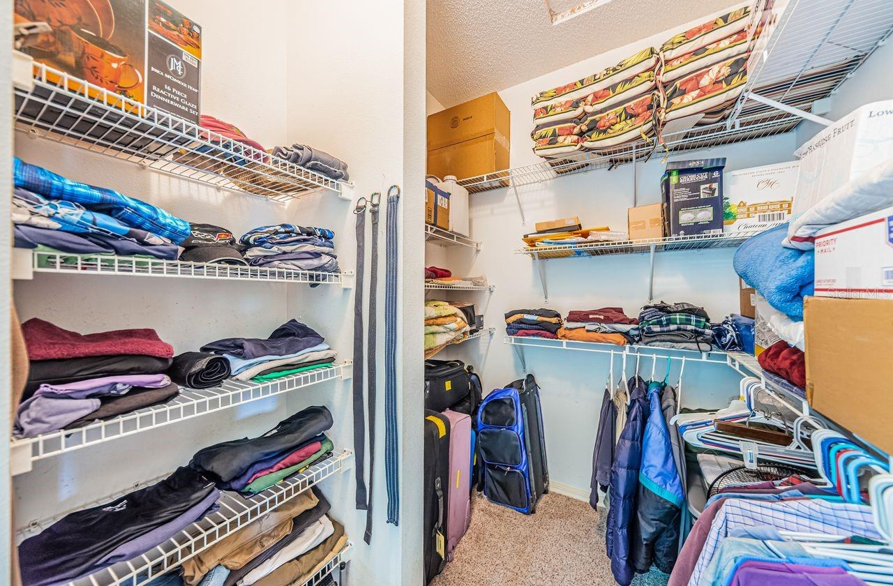Walk-in closet with built-ins keeps everything organized.
