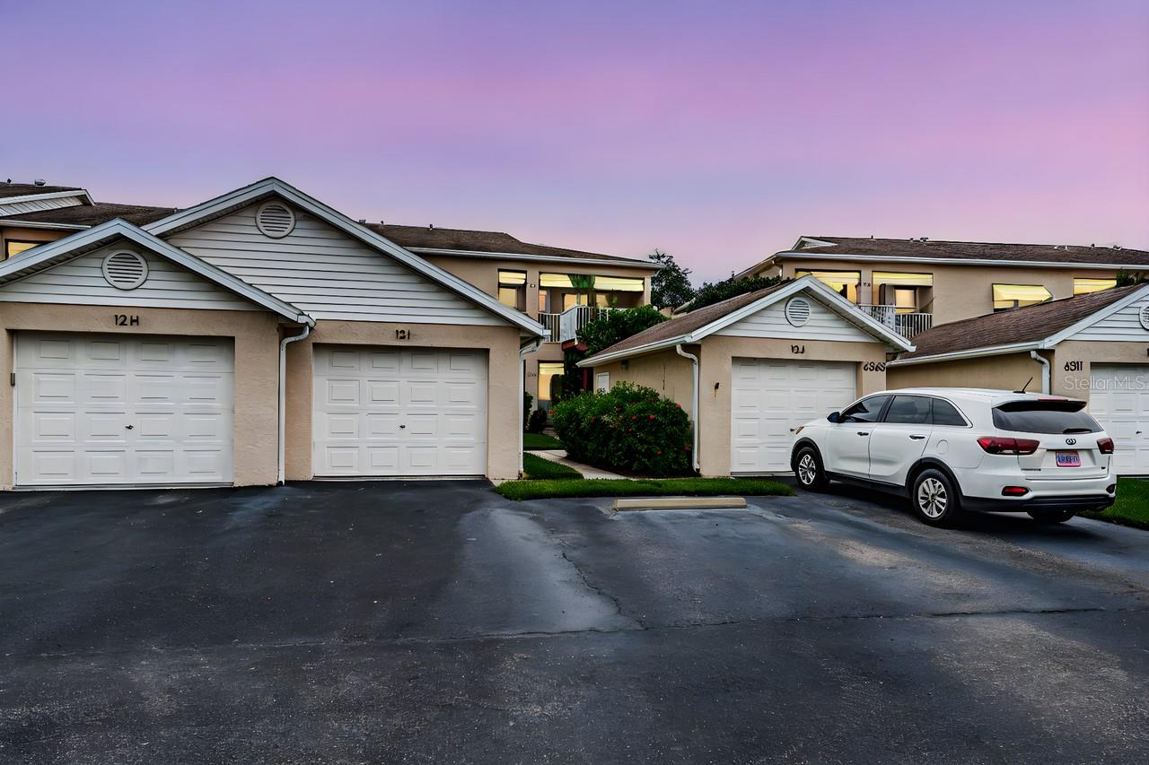 One-car garage with attic storage and convenient guest parking nearby.
