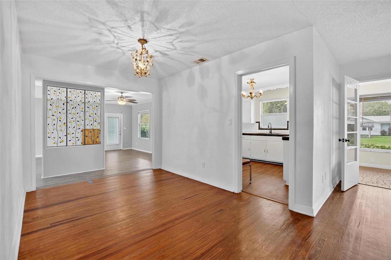 DINING ROOM TO LIVING ROOM AND SUNROOM (OFFICE) TO THE RIGHT