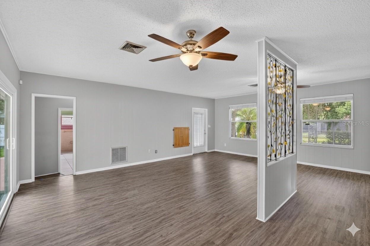 FAMILY ROOM TO LAUNDRY ROOM ENTRY ON THE LEFT AND CARPORT ENTRY ON THE RIGHT