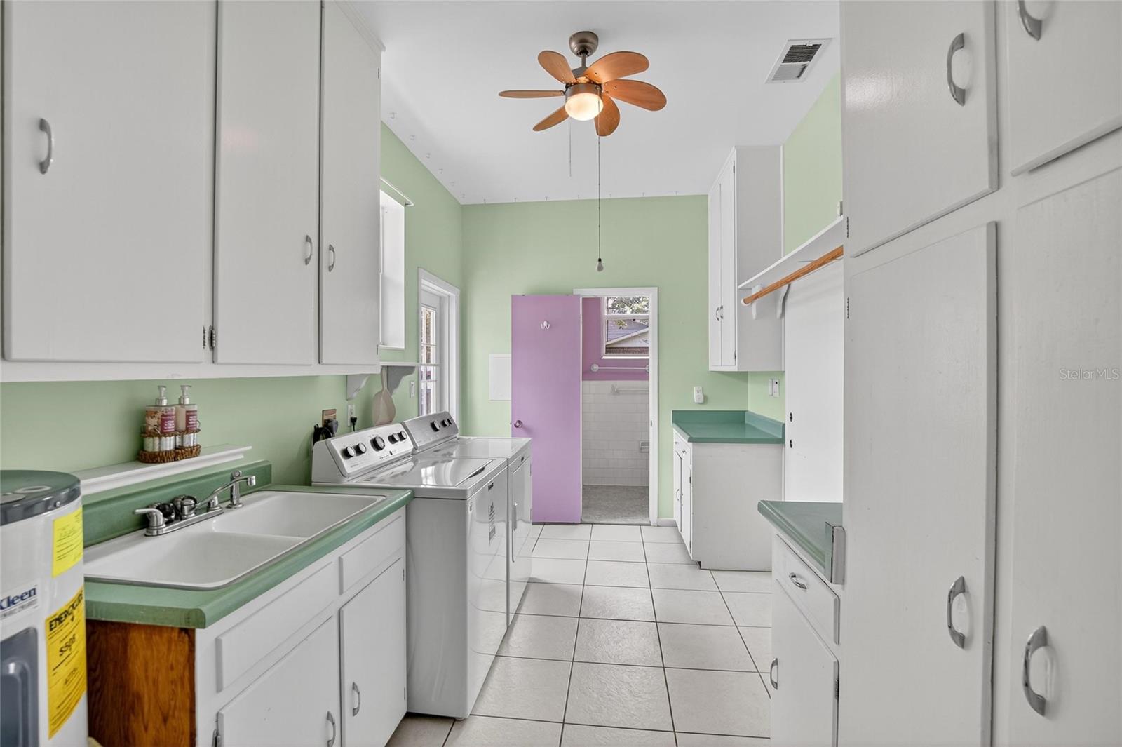 LAUNDRY ROOM WITH EXIT DOOR TO YARD ON LEFT
