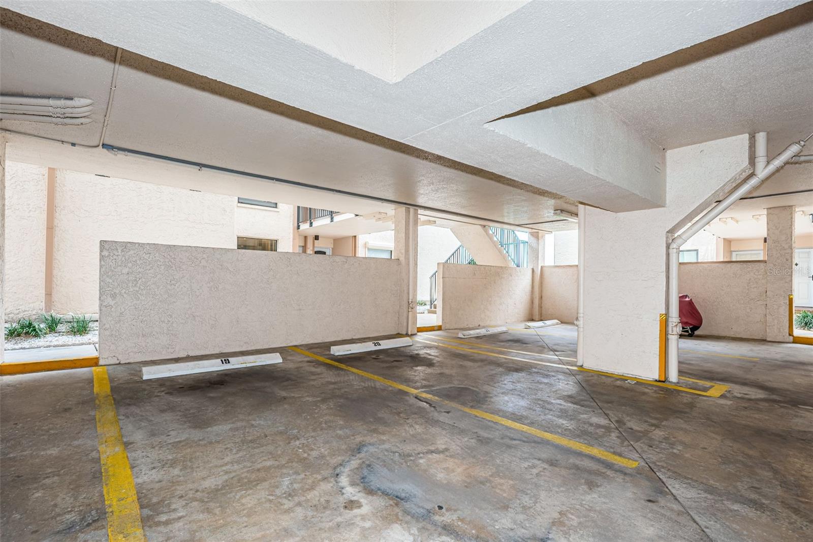 Assigned Covered Parking Space #19 just outside Entry Door of Unit