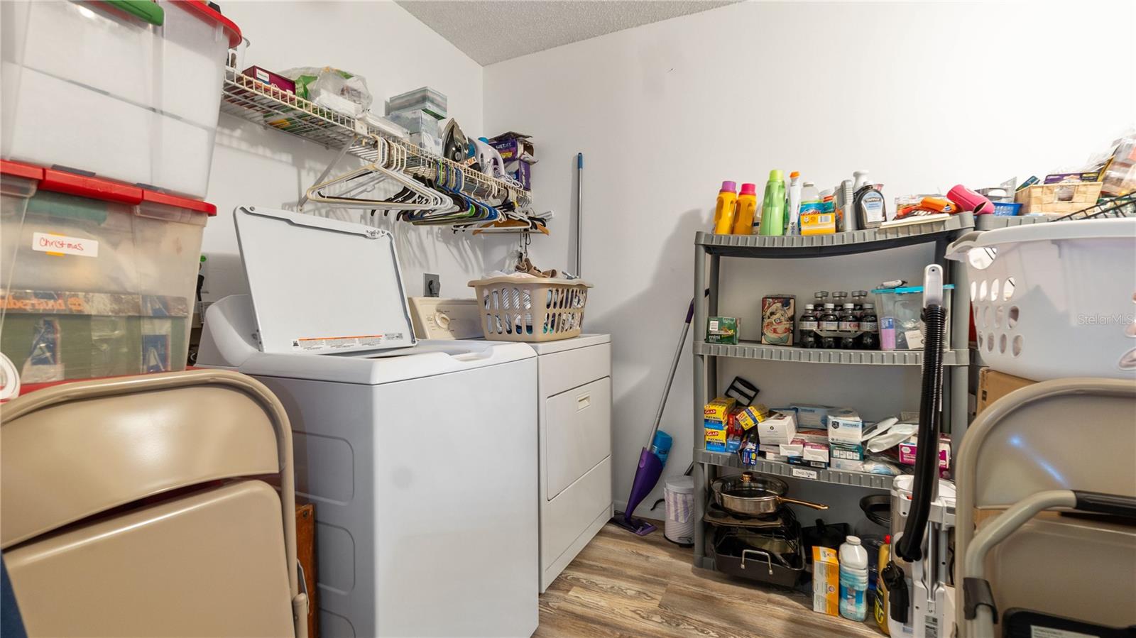 The oversized laundry/utility room offers ton's of storage for all of your personal belongins (no more storage unit fees)