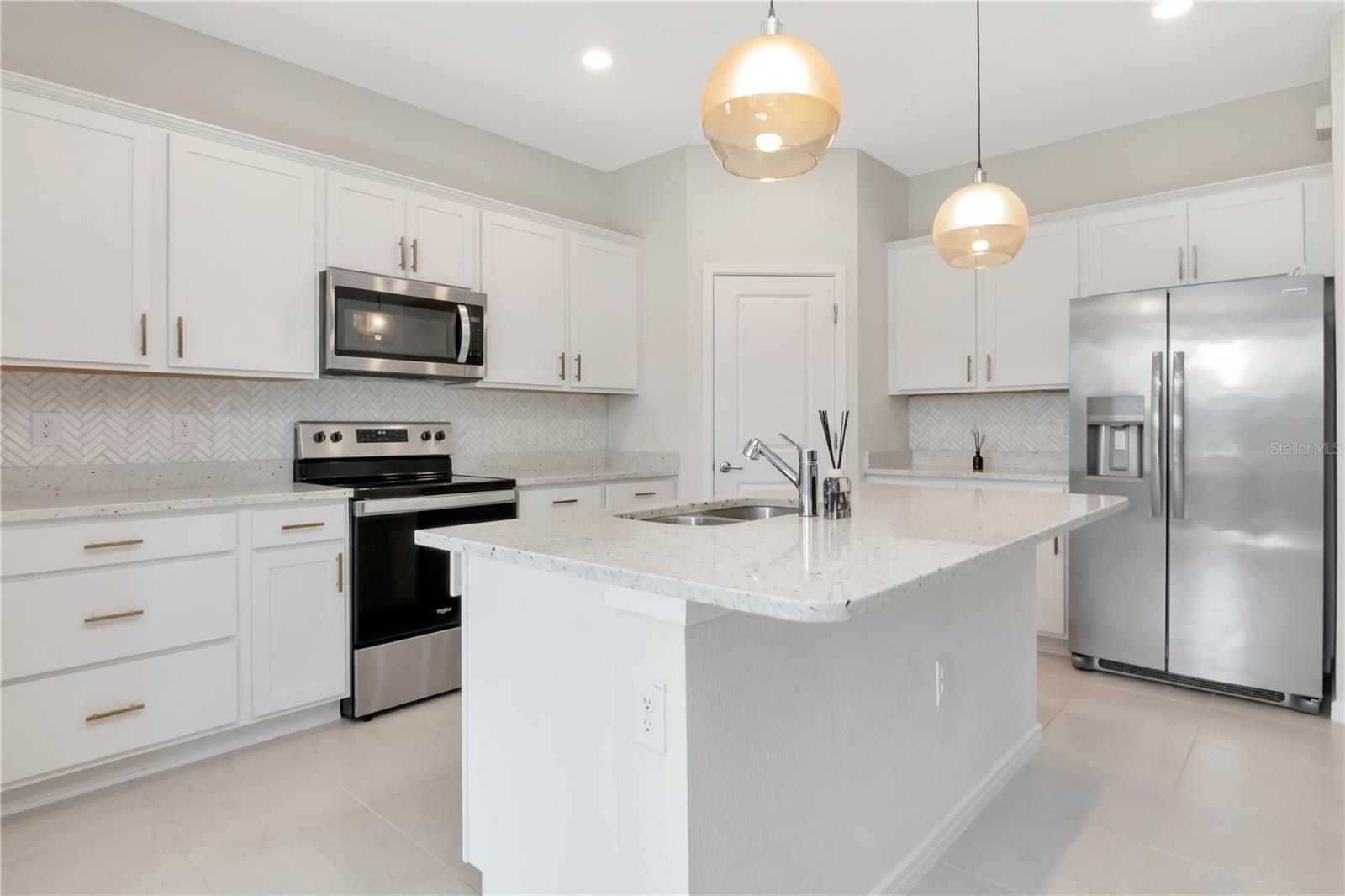 Kitchen with White Cabinets, Mold Trim, Upgraded Hardware