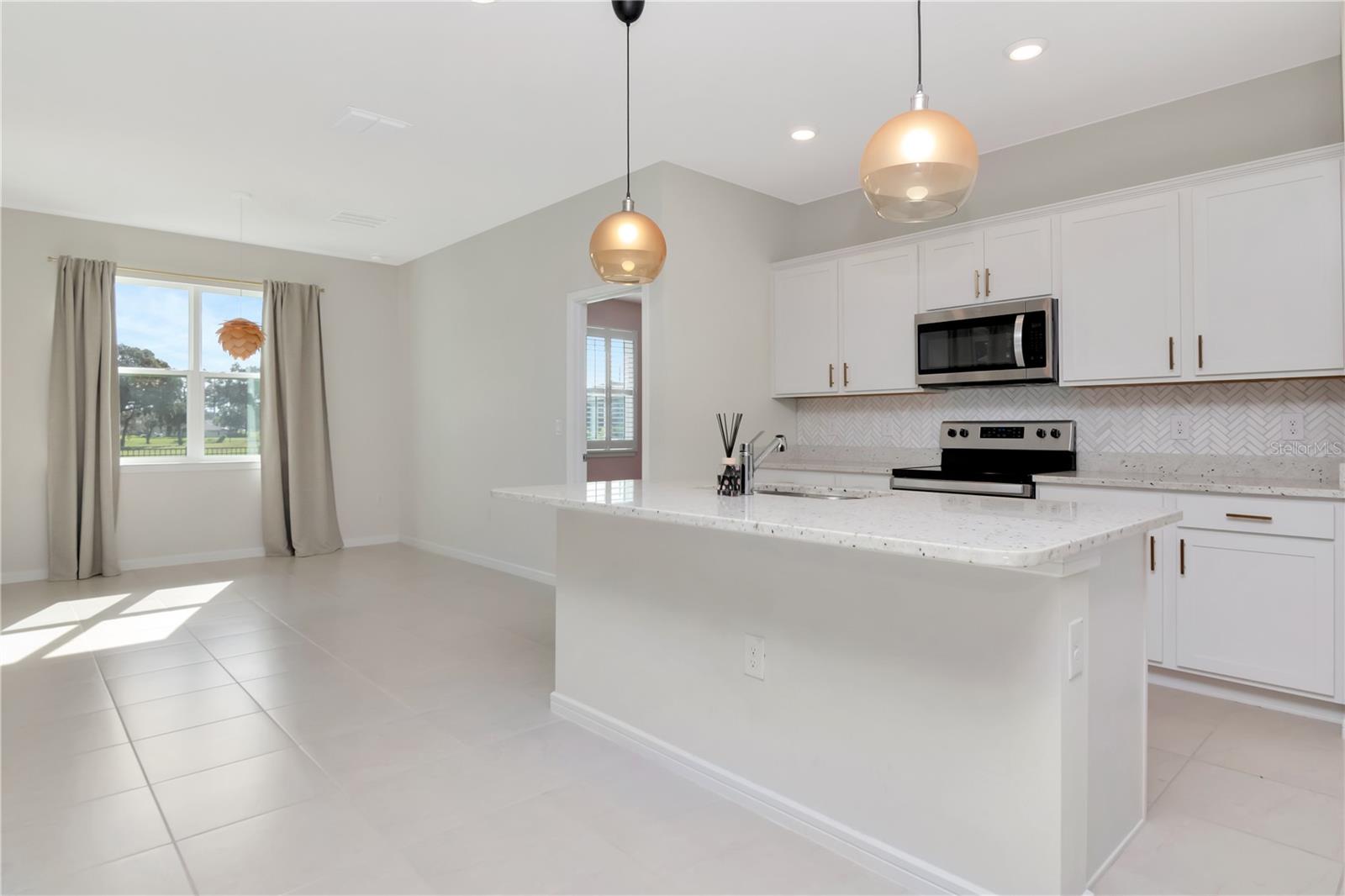 Kitchen with Island and Pendant Lighting