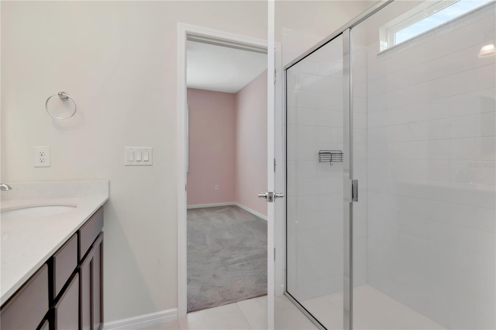 Primary En-Suite Bathroom with Dual Vanity, Quartz Countertops & Shower
