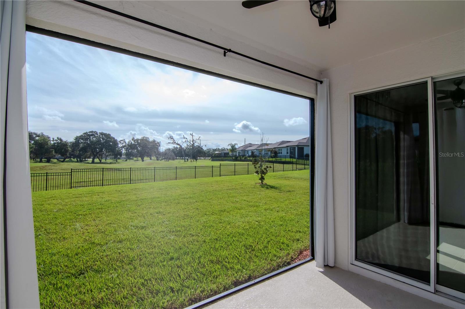 Covered & Screened Rear Lanai with Picture Screen Window for View