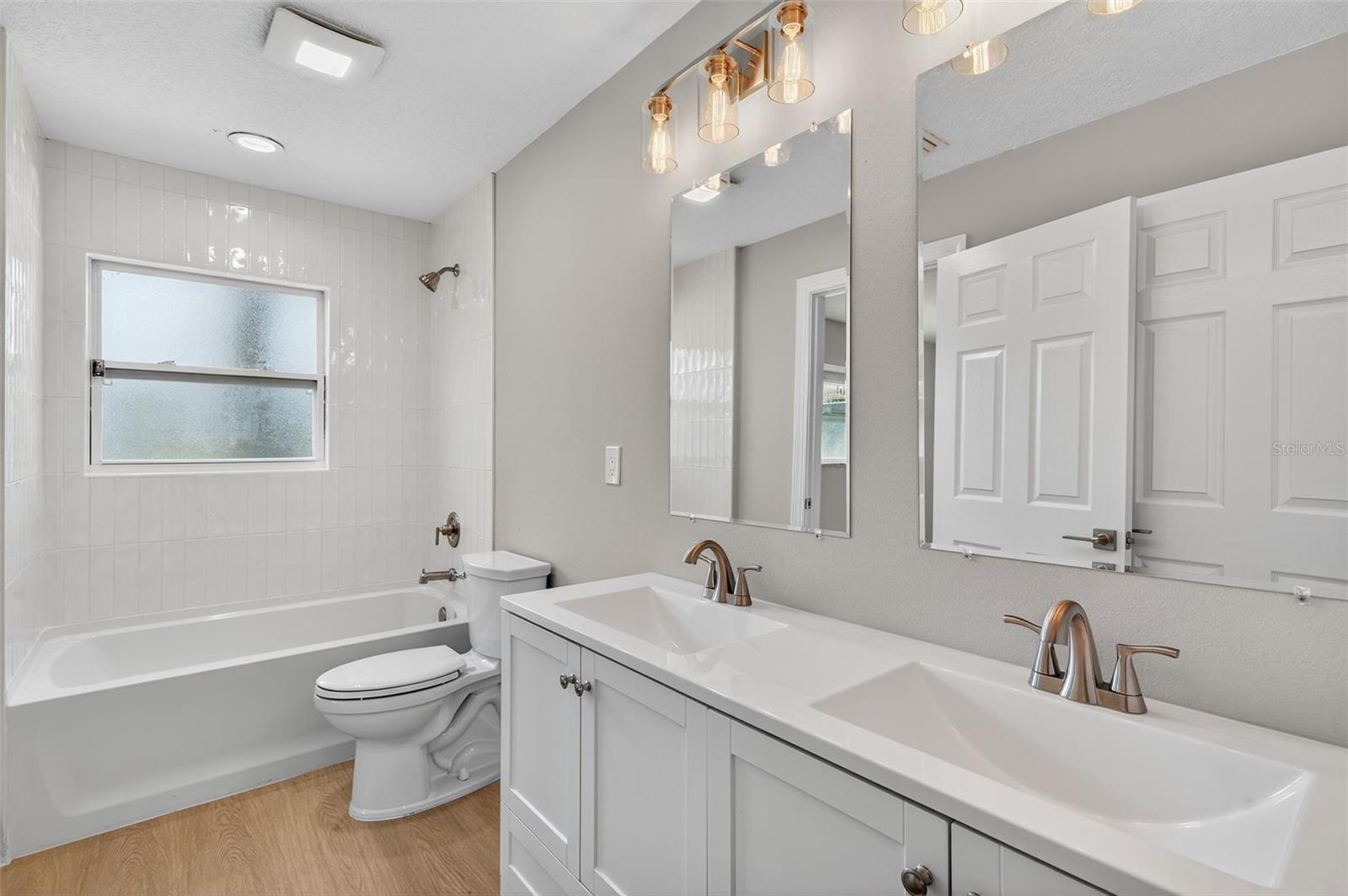 Hall Bath that also opens  to Primary Bed room