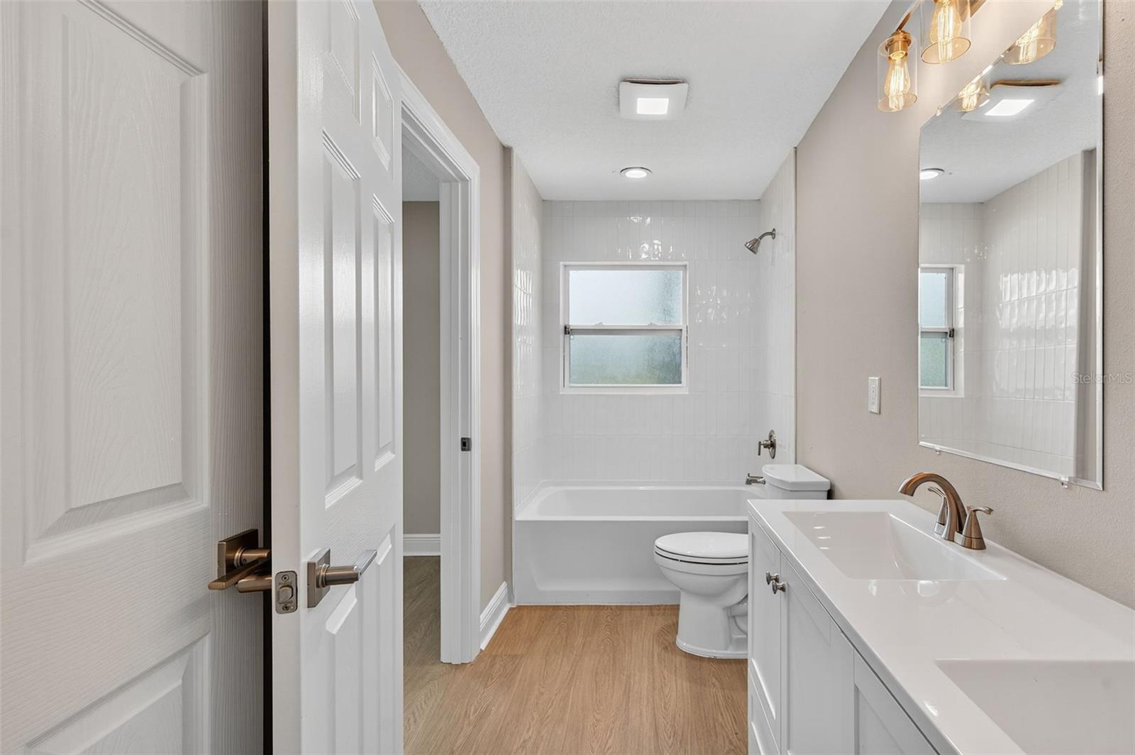 Hall Bath that also opens  to Primary Bed room