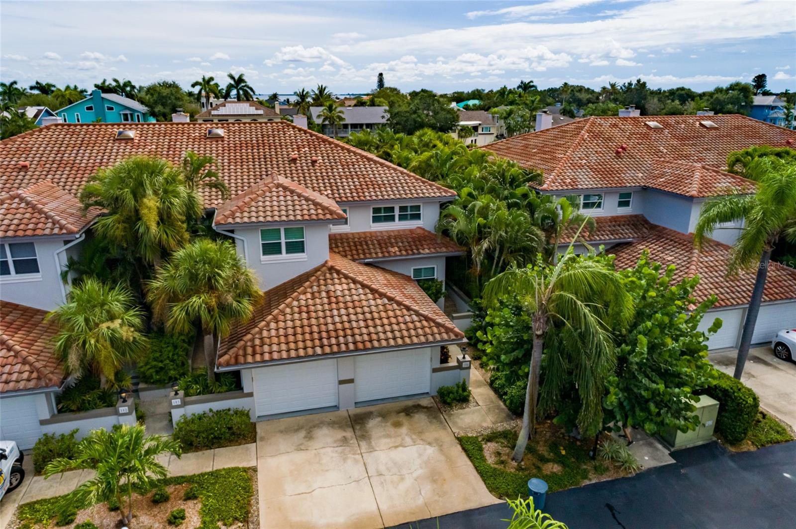 Private end-unit townhome with lush tropical landscaping.