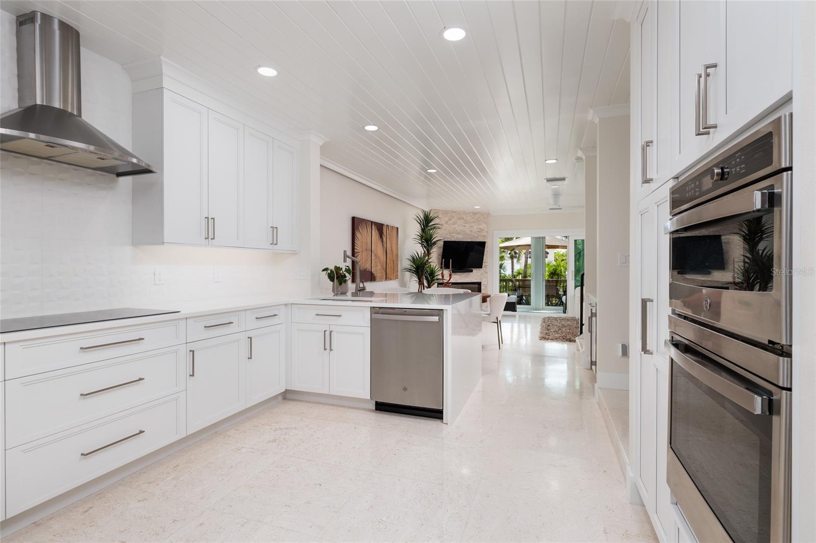 Bright chef’s kitchen with Cambria quartz counters and custom cabinetry.