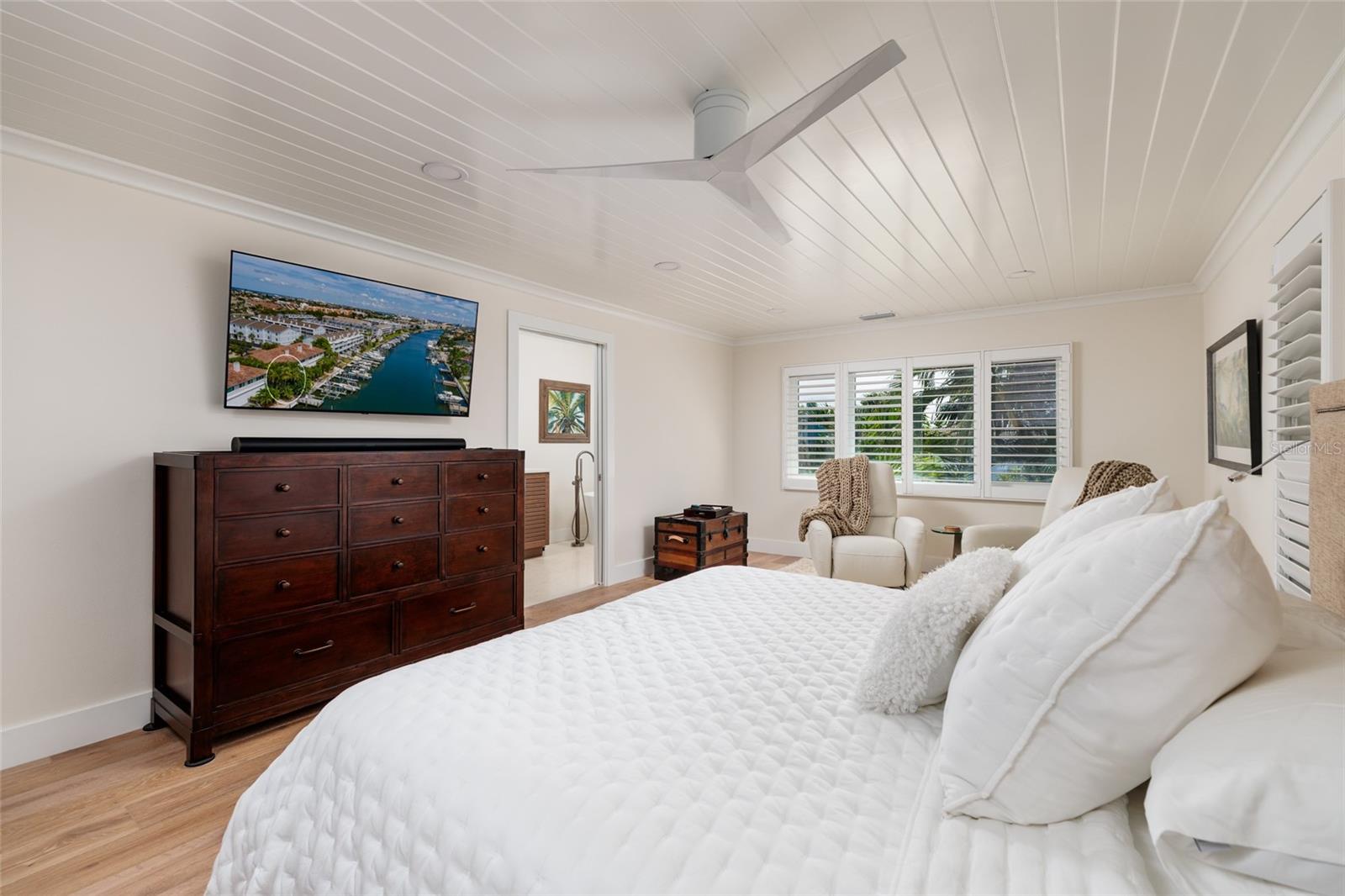 Hidden black out shades behind plantation shutter for when you need to sleep in