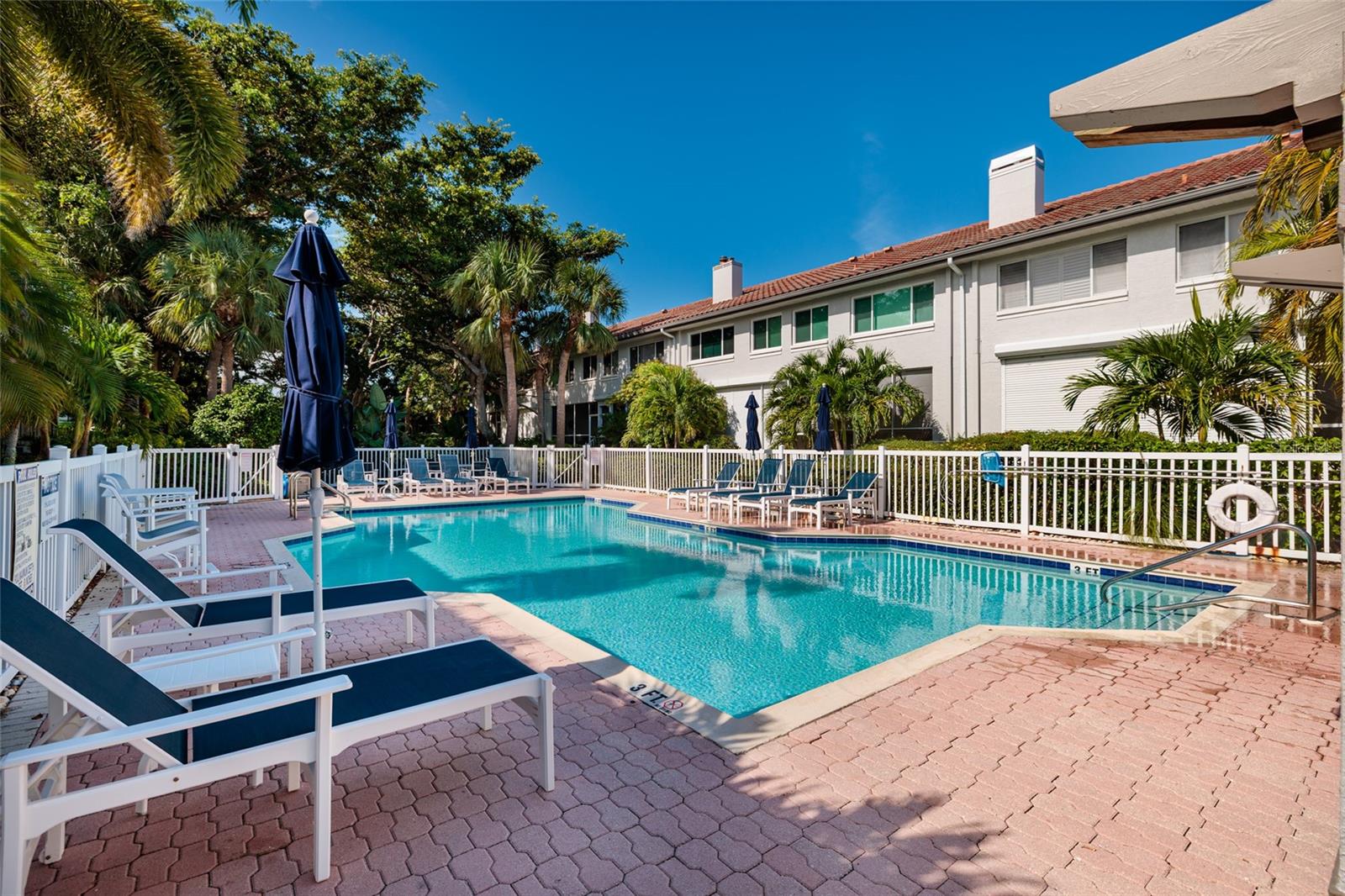 Resort-style pool and spa with sun deck and lounge seating