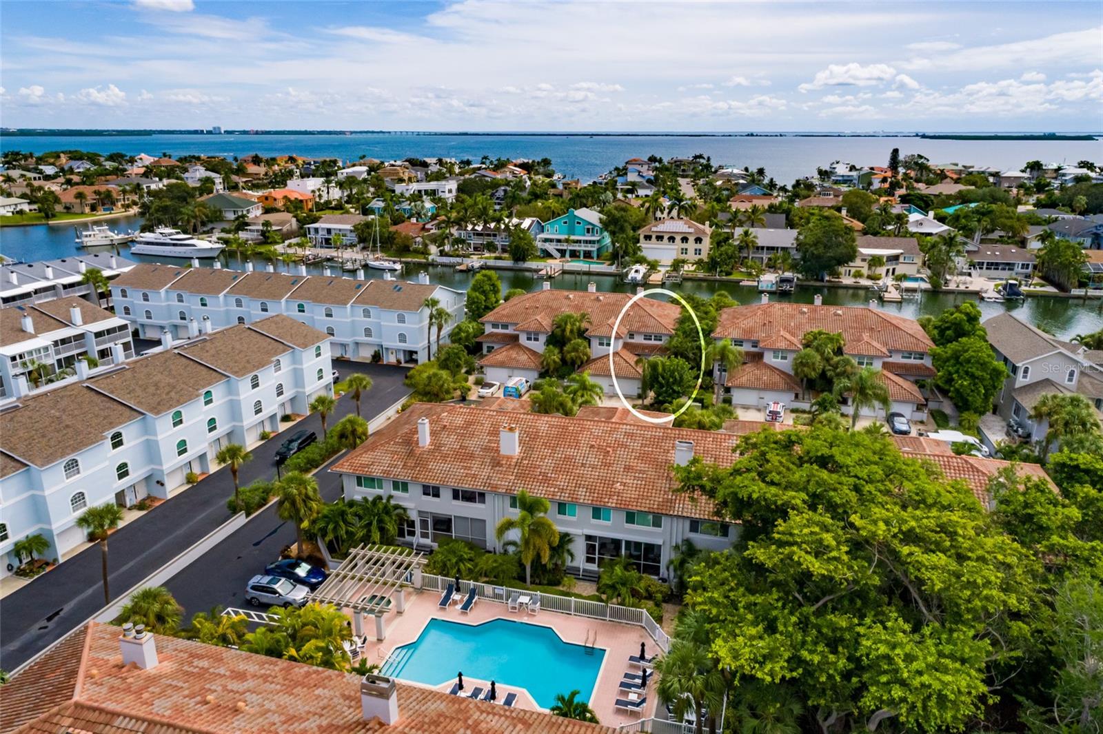 Heated resort-style pool and spa with tropical landscaping.