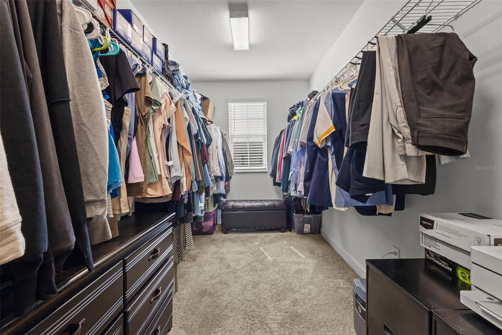 Walk in primary suite closet