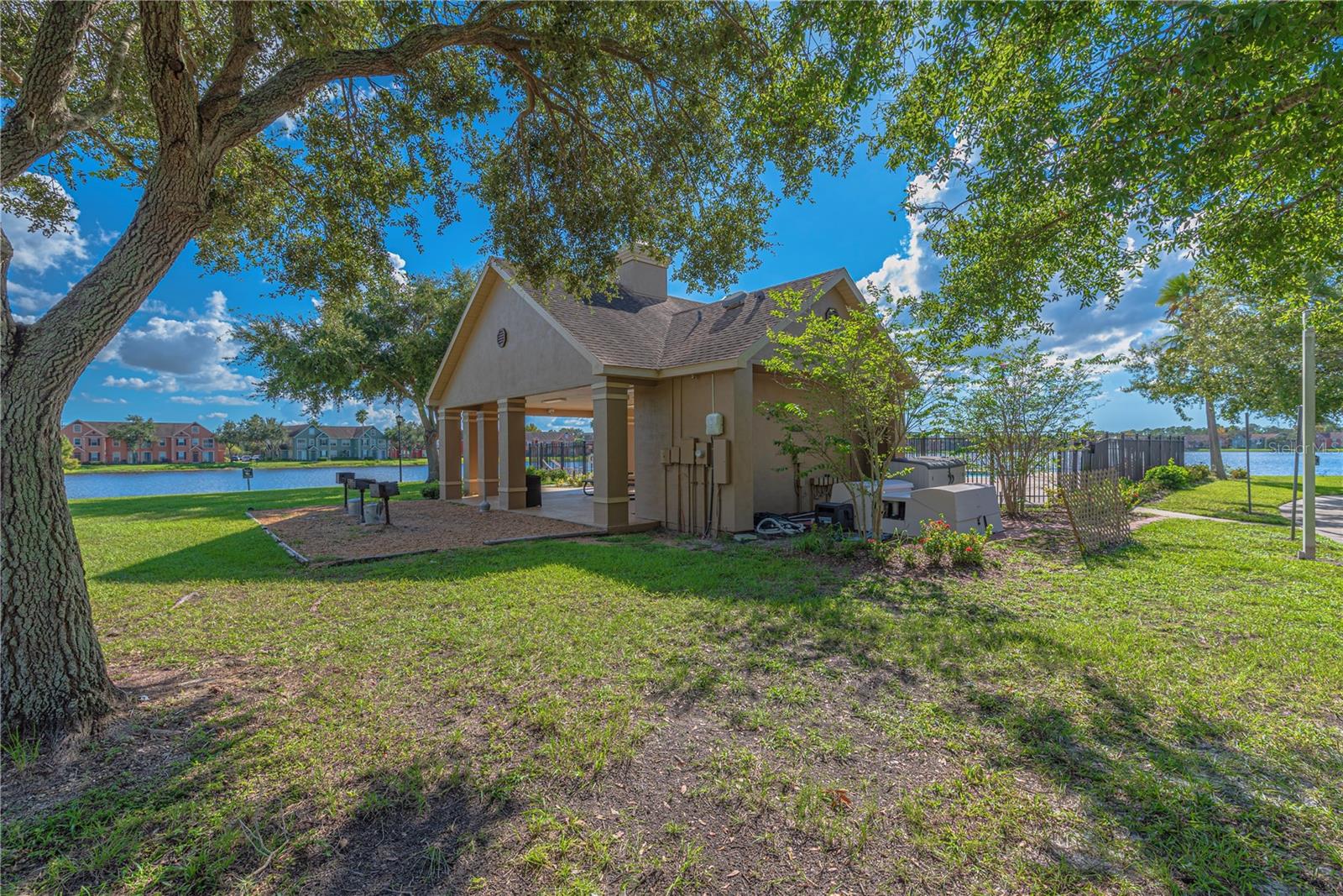 Covered pool lanai with BBQ station.