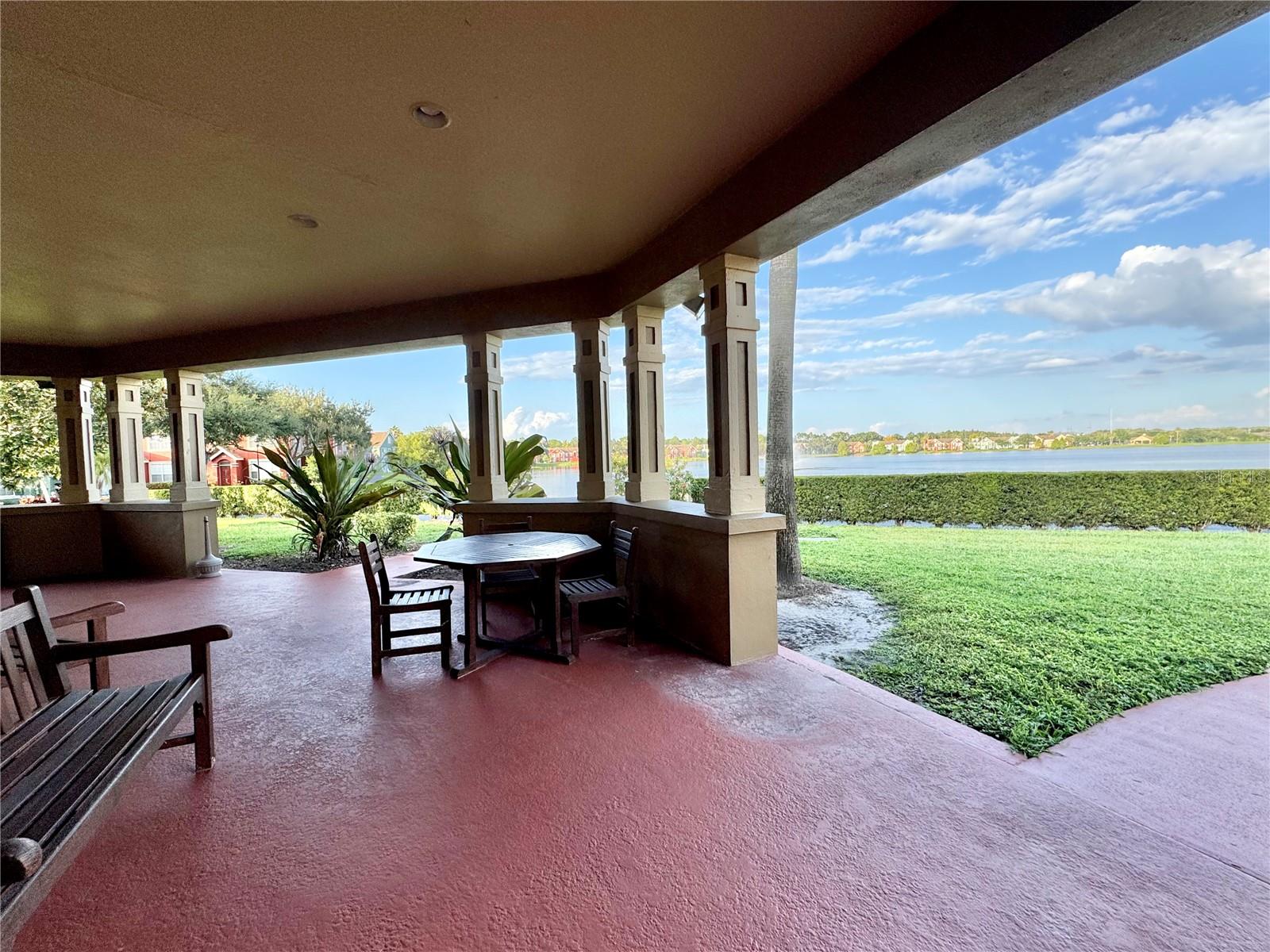 Covered lakeside seating area at the clubhouse.