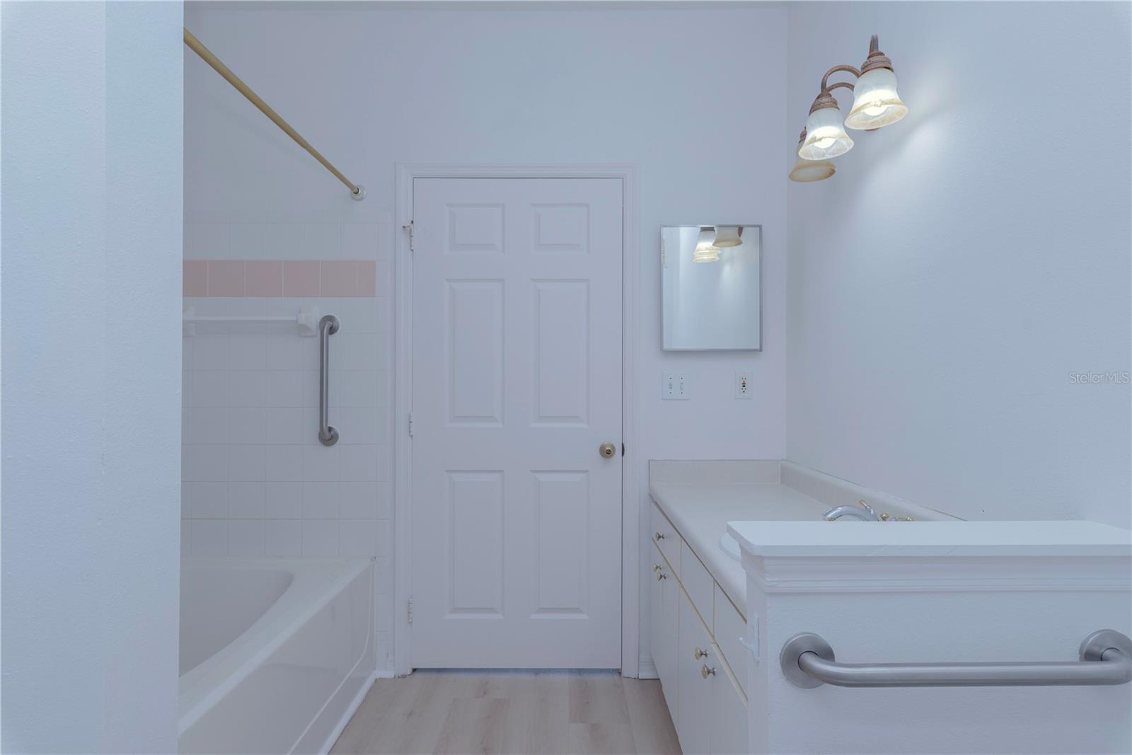 Bathroom with entrance to the bedroom and living room.