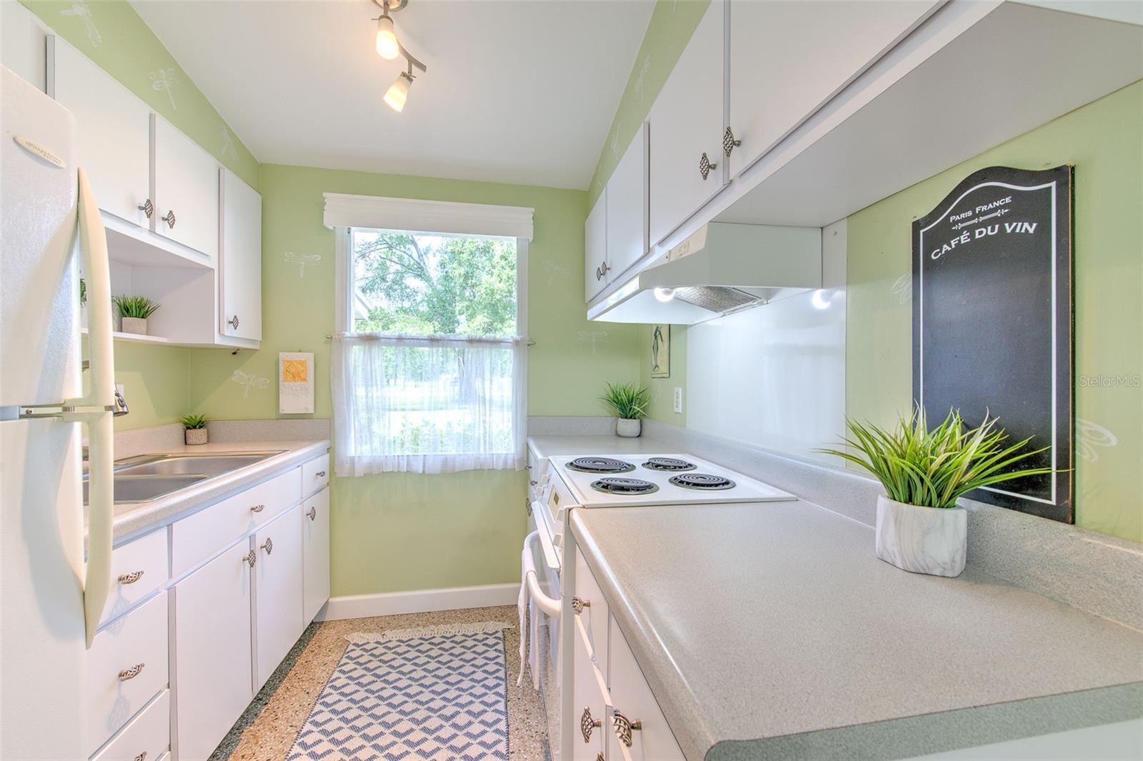 Kitchen with a big window & lots of natural sunlight