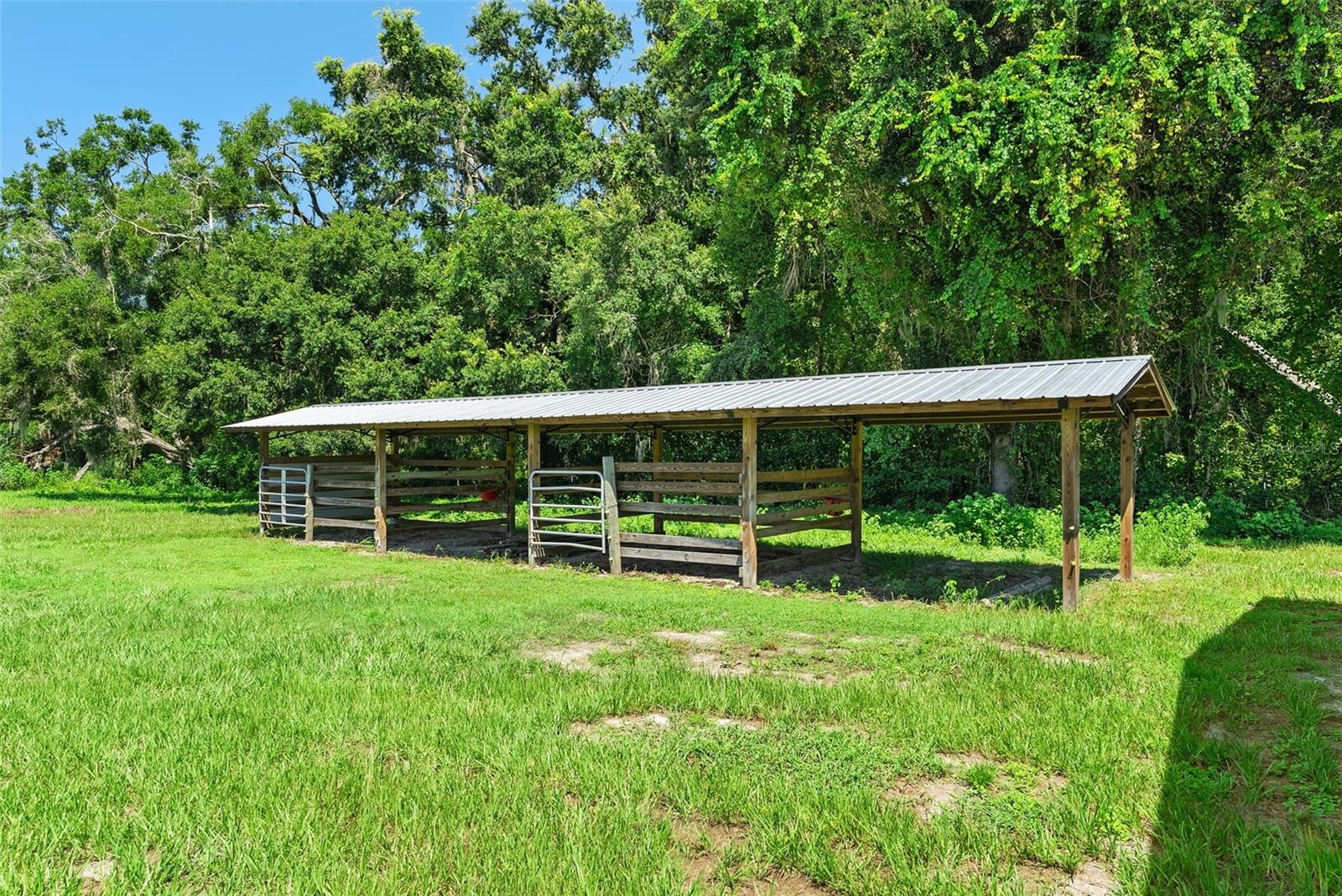 open pole barn with stalls