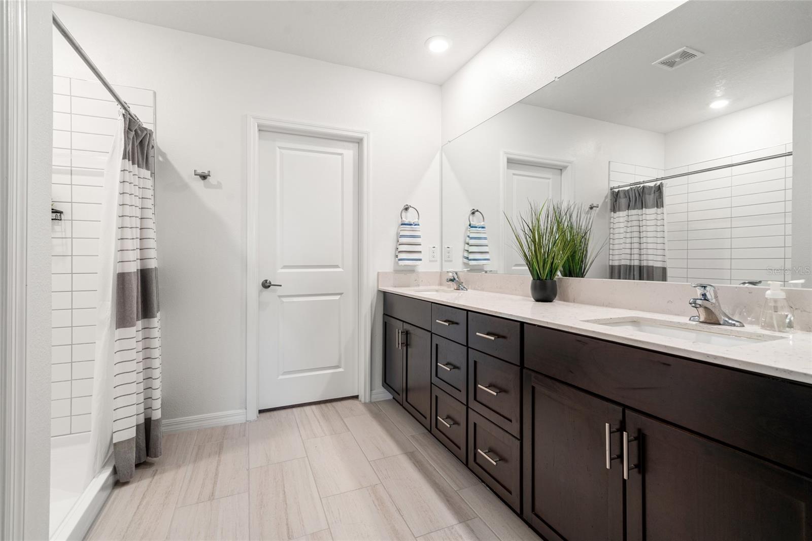 Primary Ensuite Bathroom & Entrance to Walk In Closet