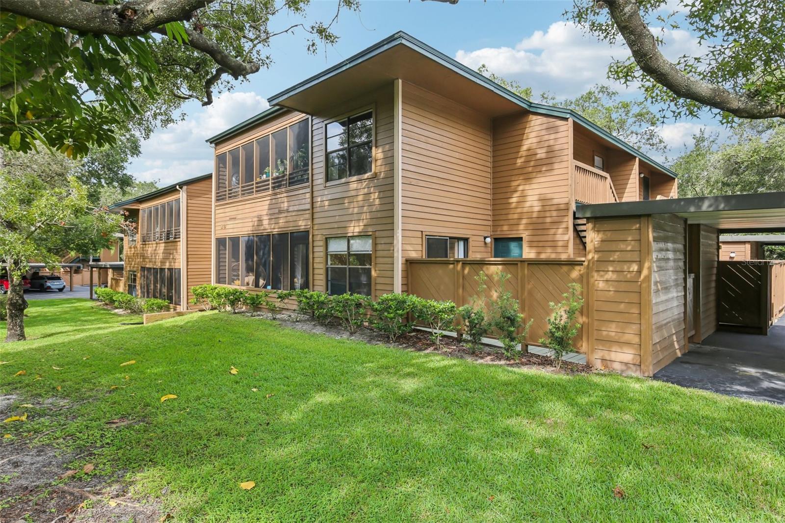 Corner condo with private courtyard entry and forest views!