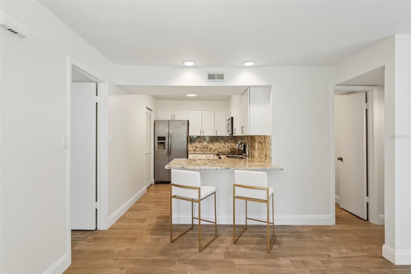 Counter-height breakfast bar for socializing while cooking.