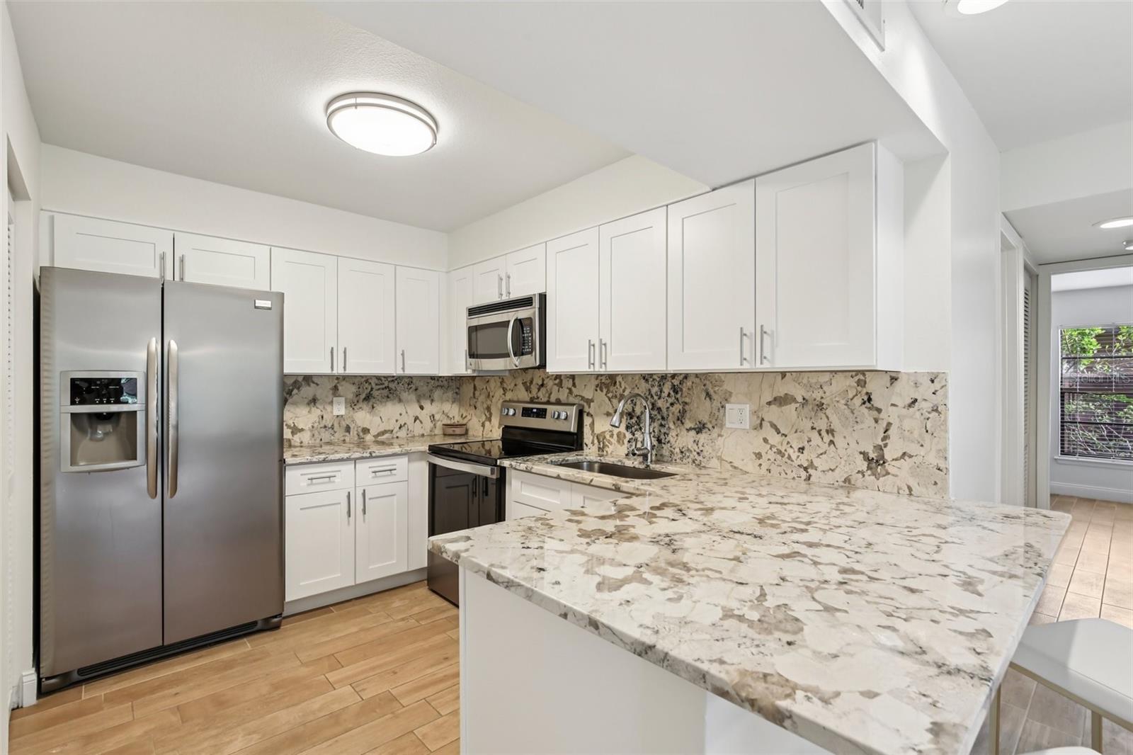 Spacious kitchen with new cabinets and stainless appliances!