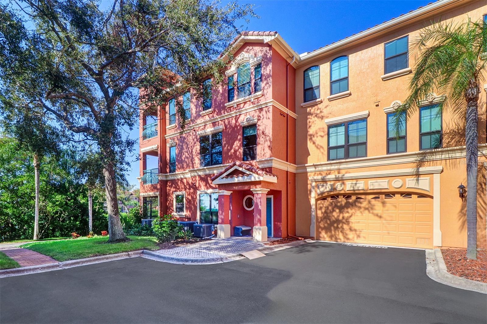 Front view of the townhome with garage