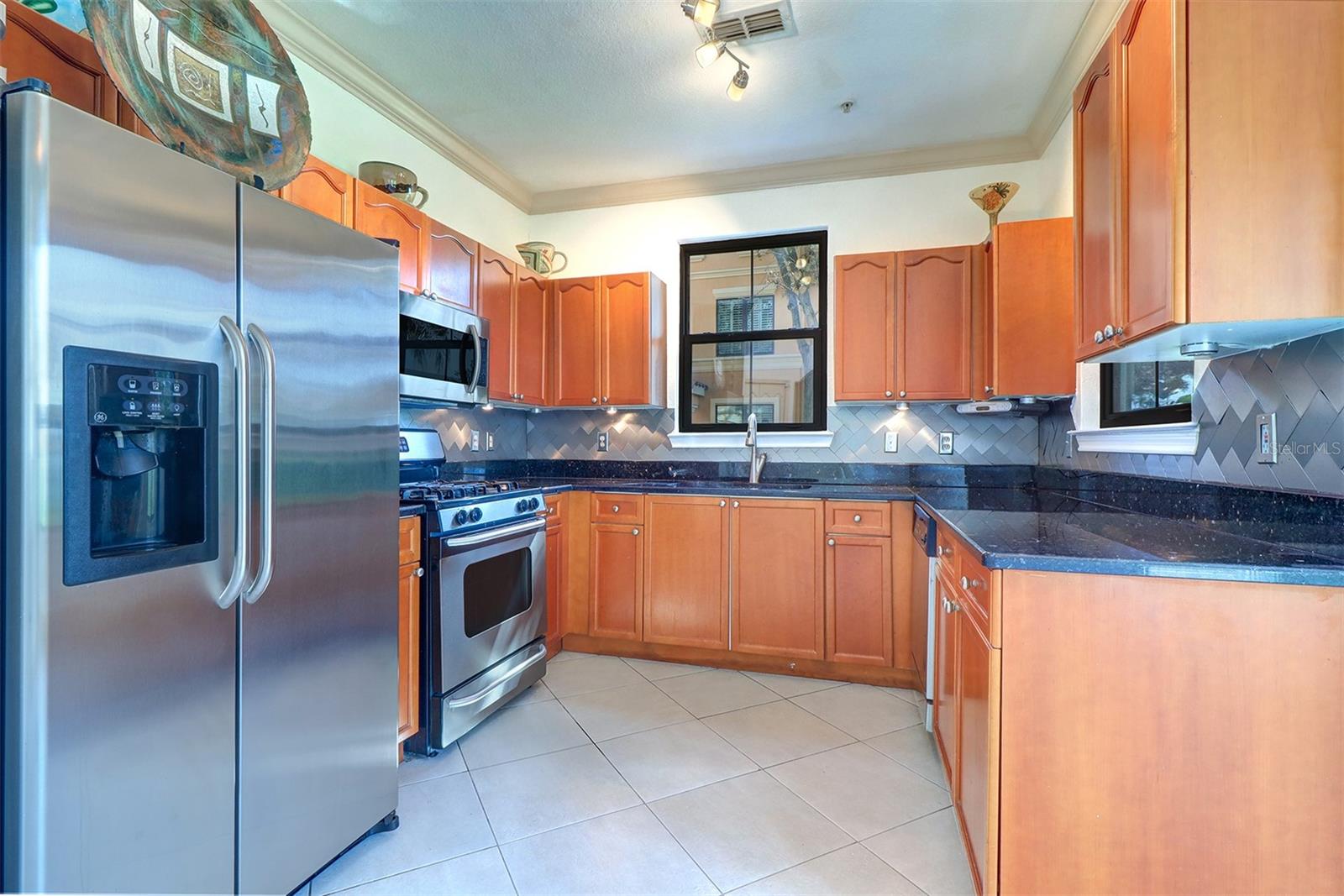 Light and bright kitchen with water views from either window as you cook!