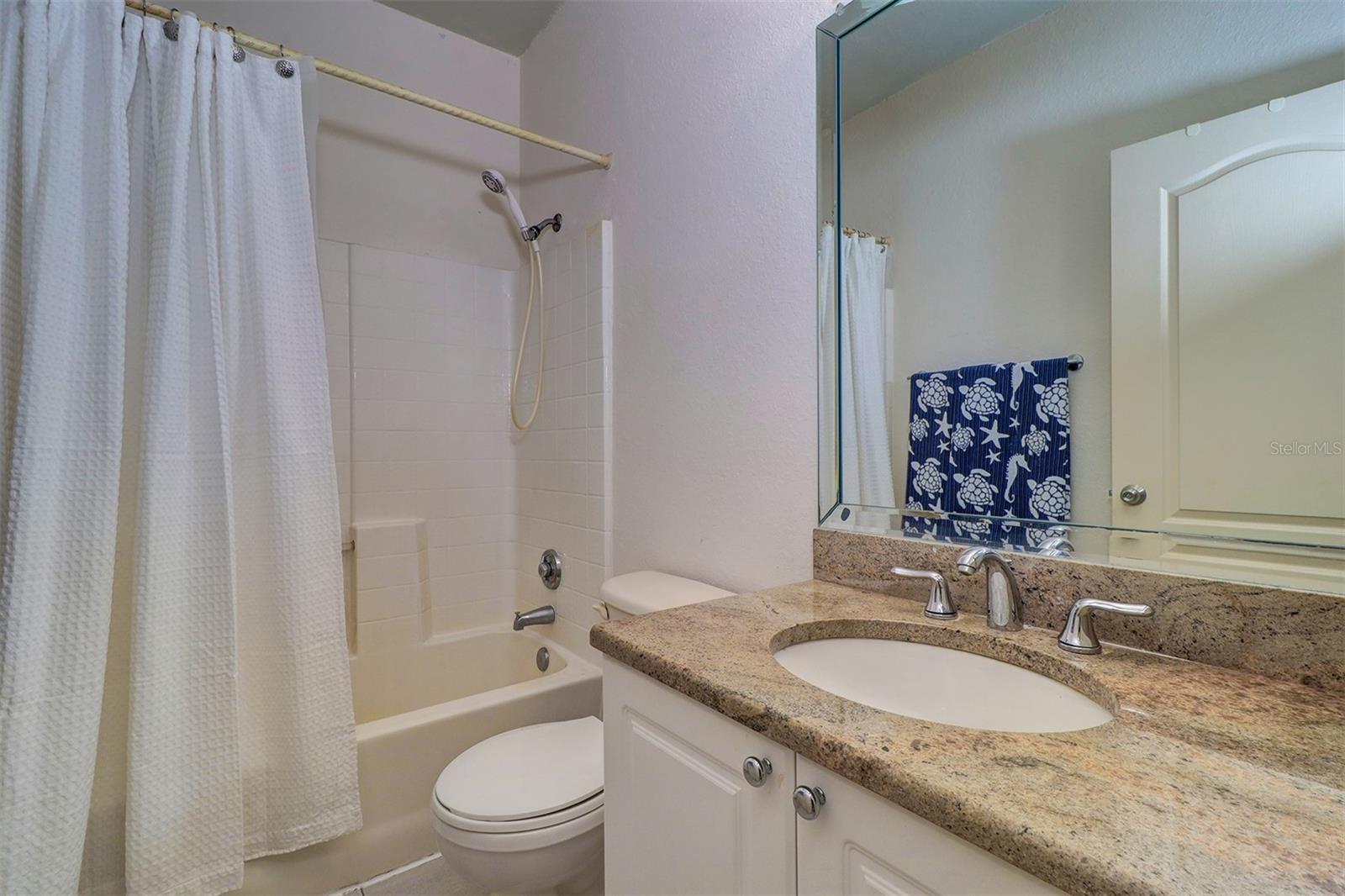 Hall bath with tub/shower combination for 2nd and 3rd bedrooms