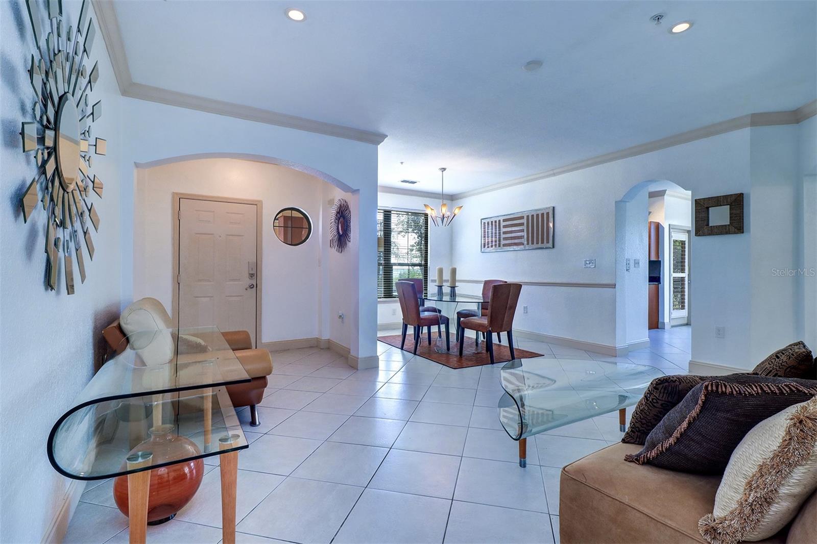 View of the foyer/entry hall, living and dining rooms