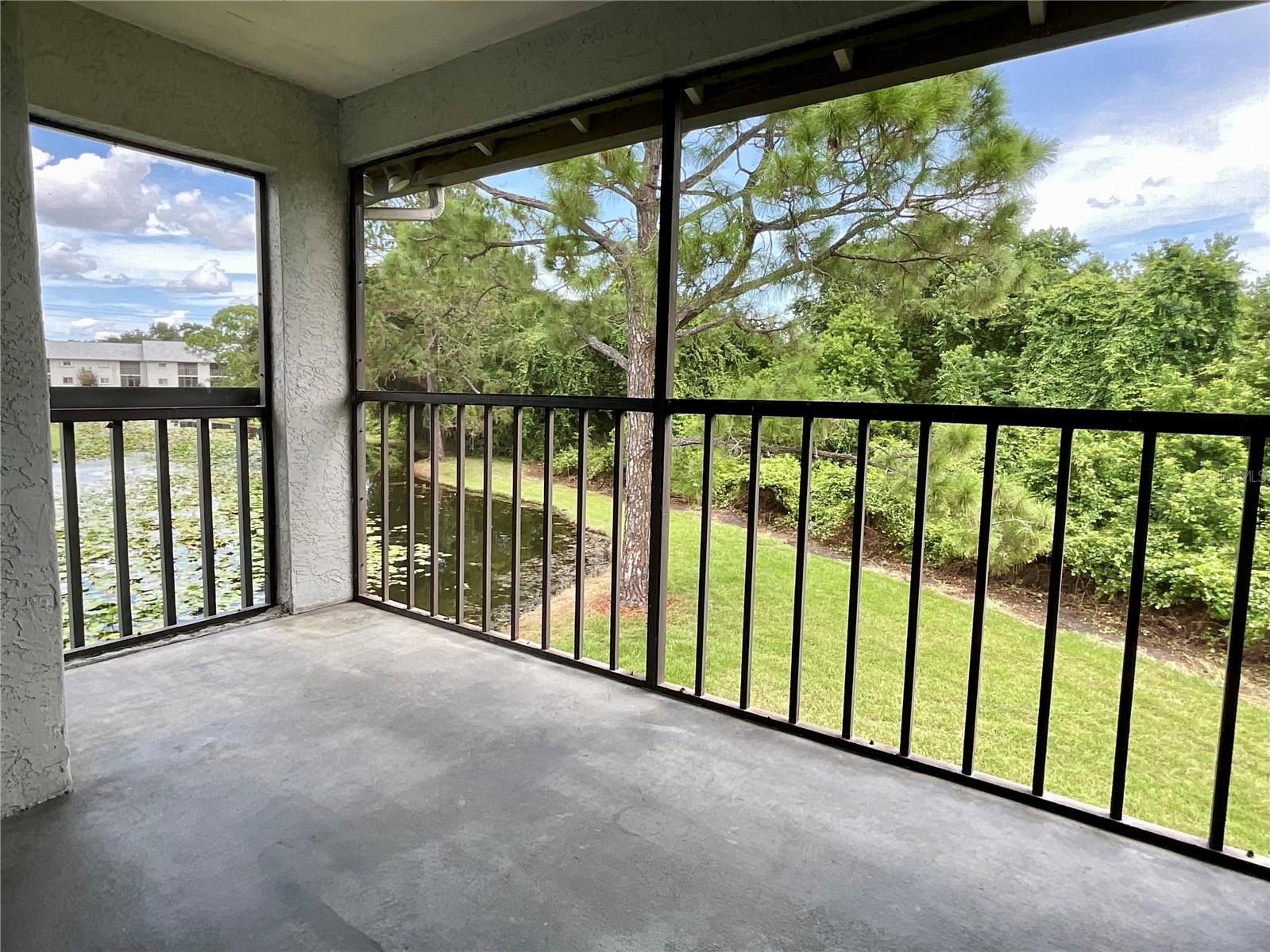 16-Covered, screened balcony view