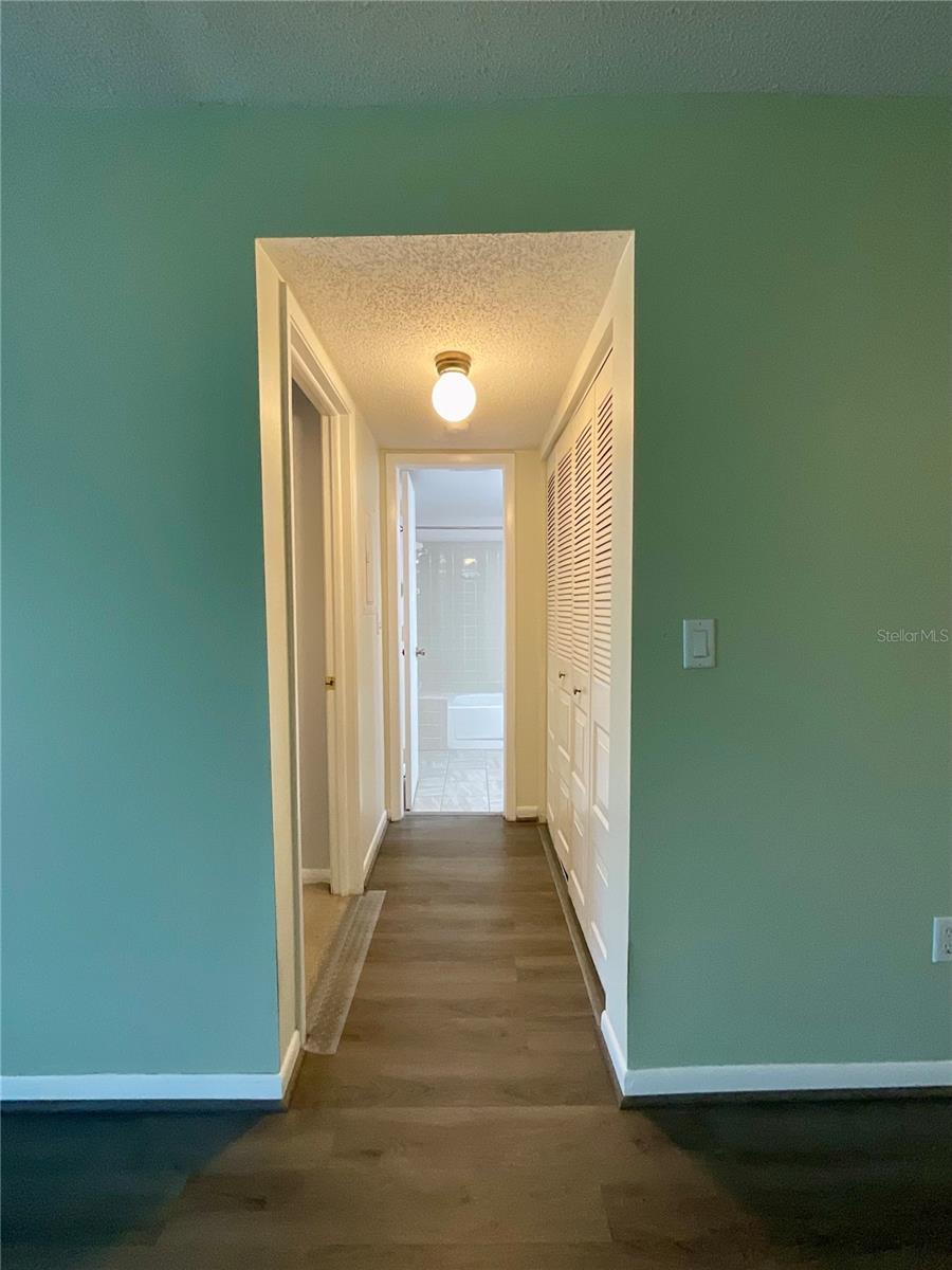 18-Hallway to laundry, bedroom, and bathroom