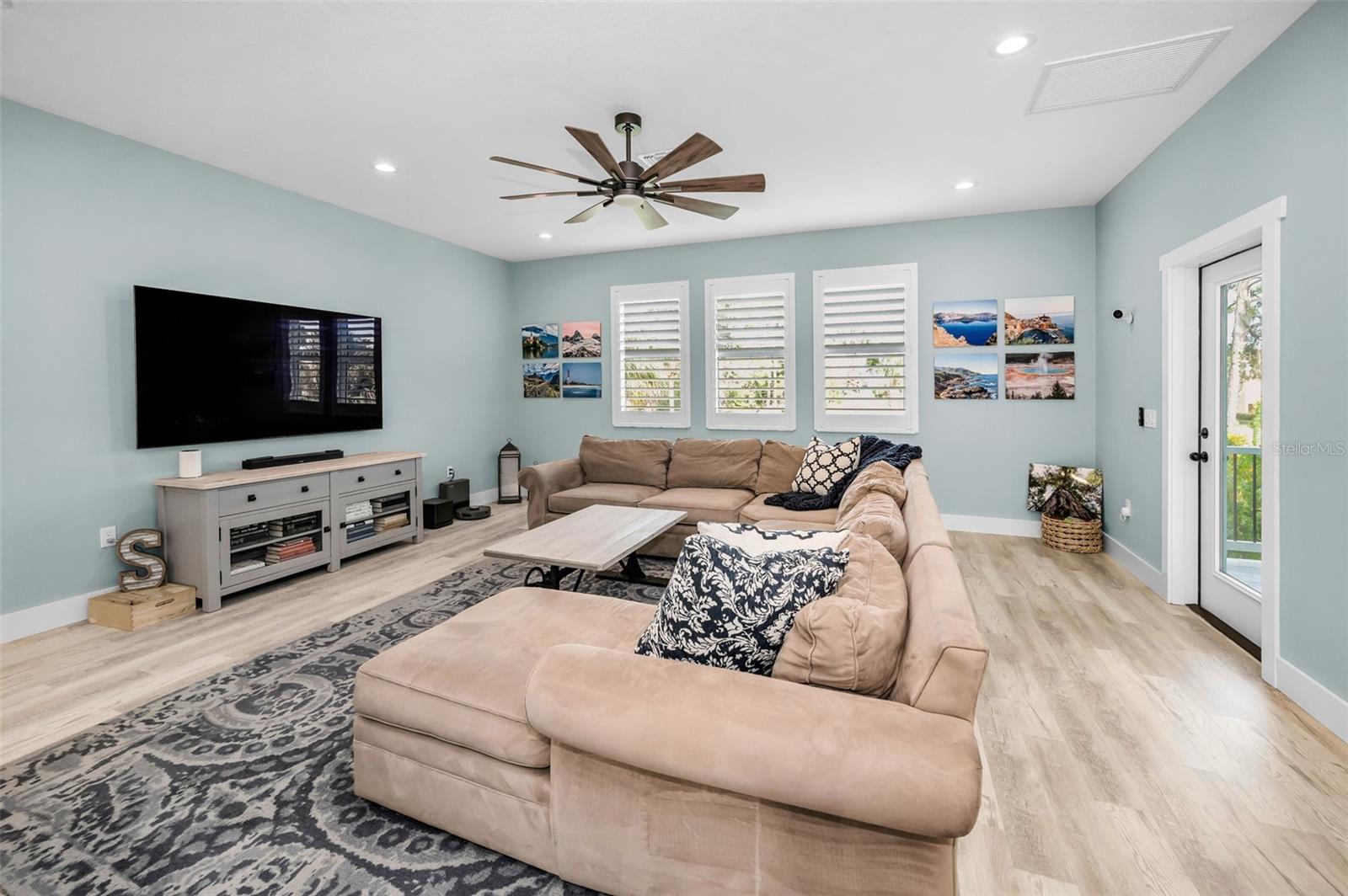 Living Room - Plantation shutters, luxury vinyl and patio access