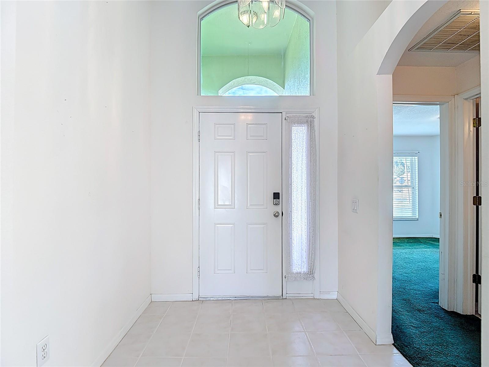 Entrance with bedroom 4/office and full bathroom to the right