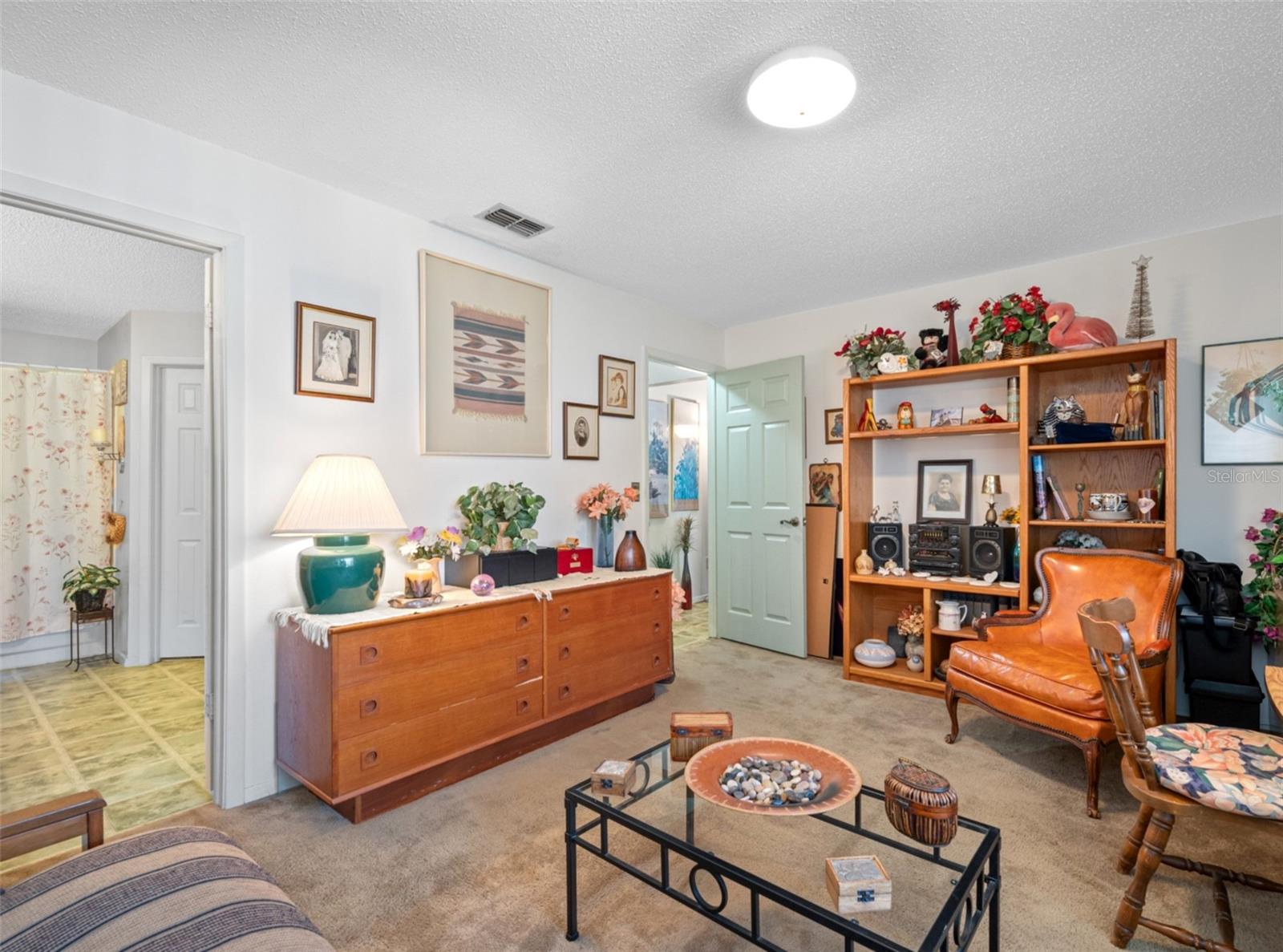 A large second bedroom used as an extra family room/office