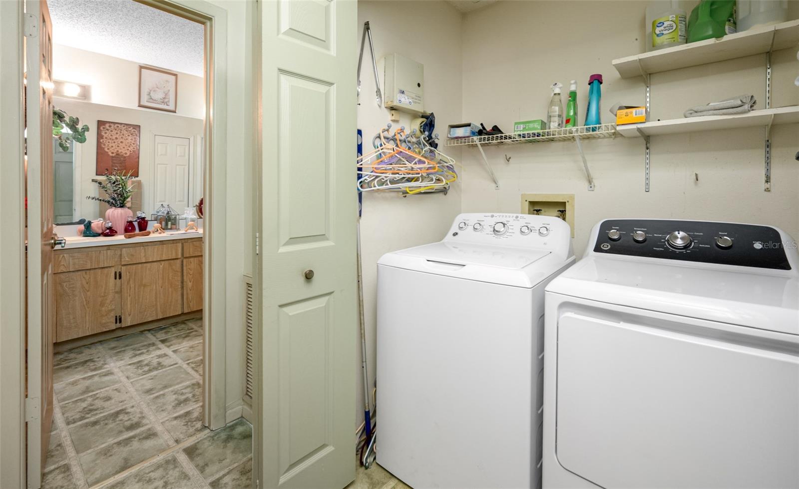 Convenient laundry space with foldaway doors