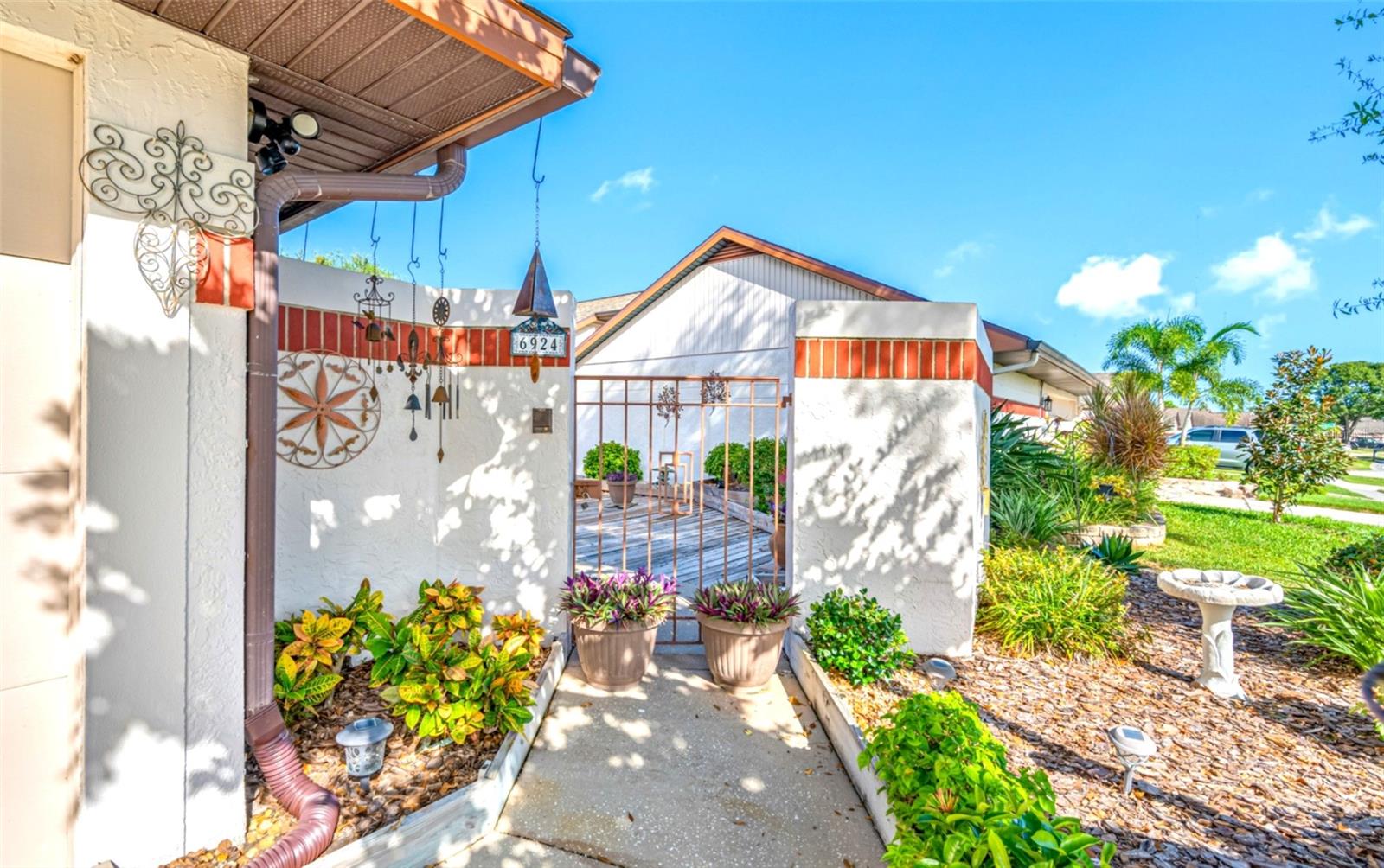 Charming Mediterranean courtyard with a touch of eclectic charm