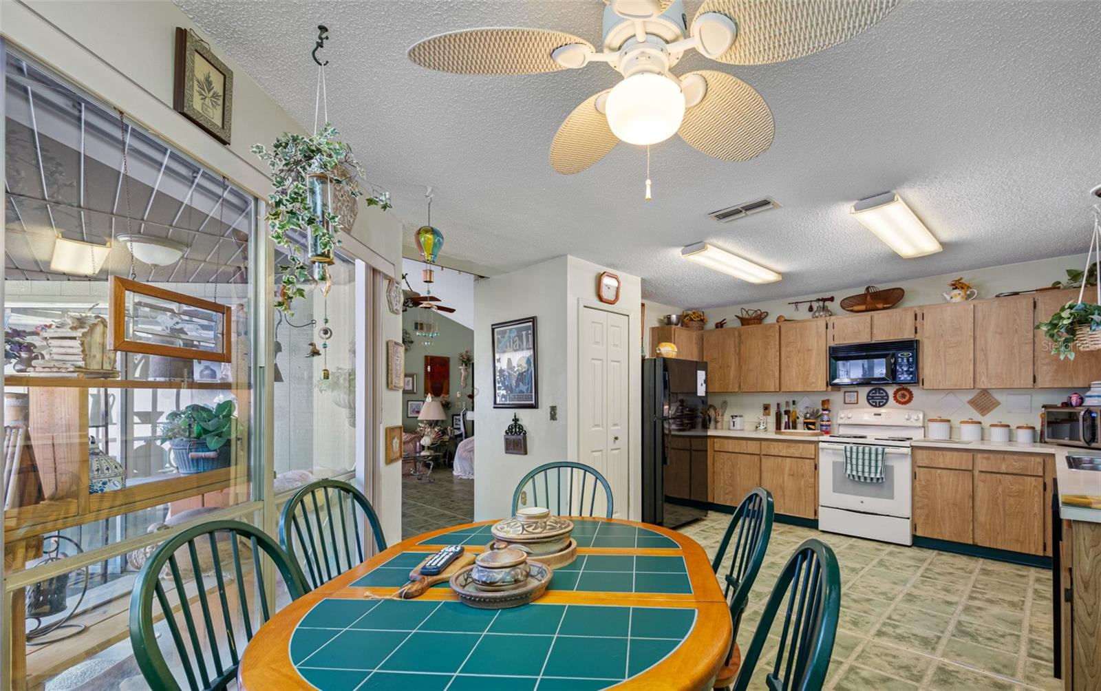 Large kitchen with a view of the open-air patio