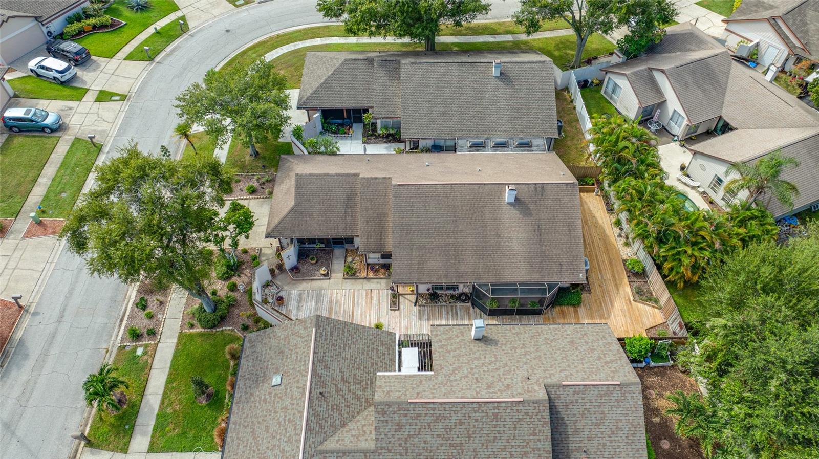 Large area deck surrounding the side and back of the home