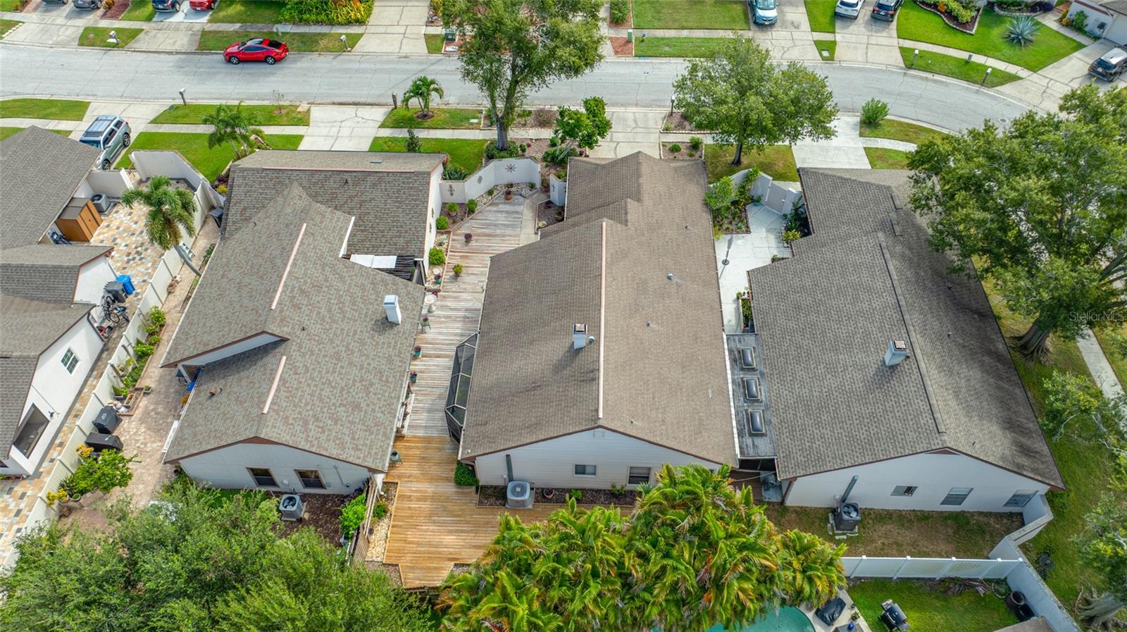 The back of the home, showing the long sprawling wood deck