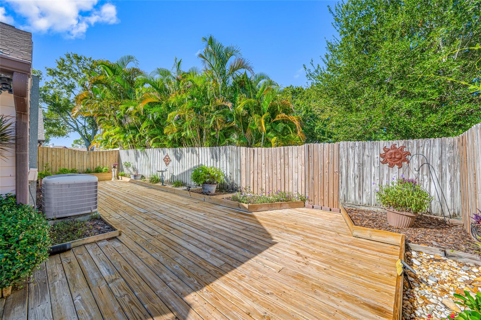 Decking continues around the back of the home for additional entertaining, garden area and relaxation space