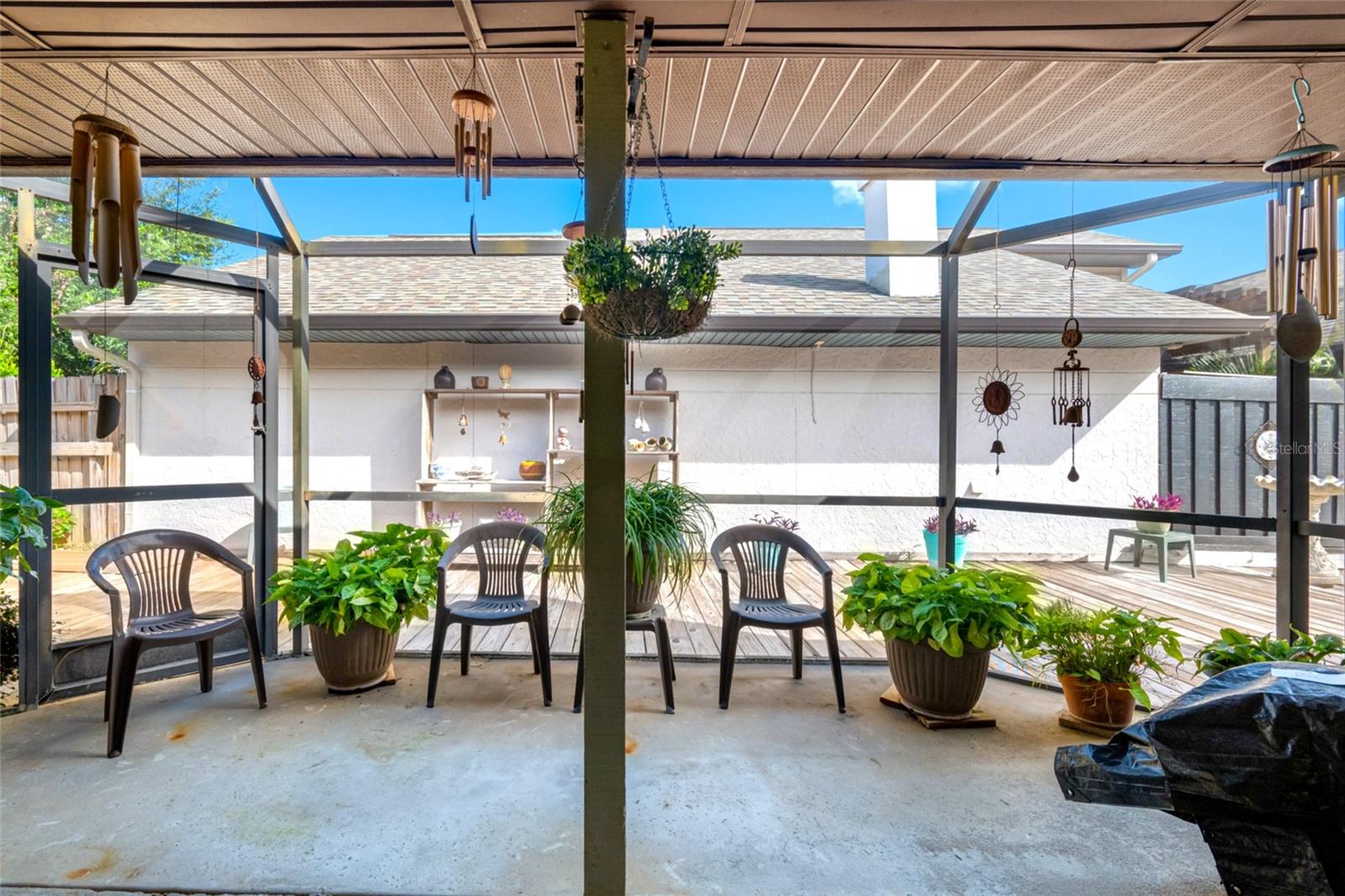 A large open-air patio provides a cool breezy space to relax and entertain