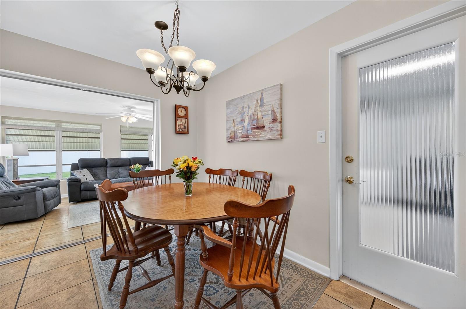 Dining area. Kitchen to the left, garage to the right, Florida room straight ahead.