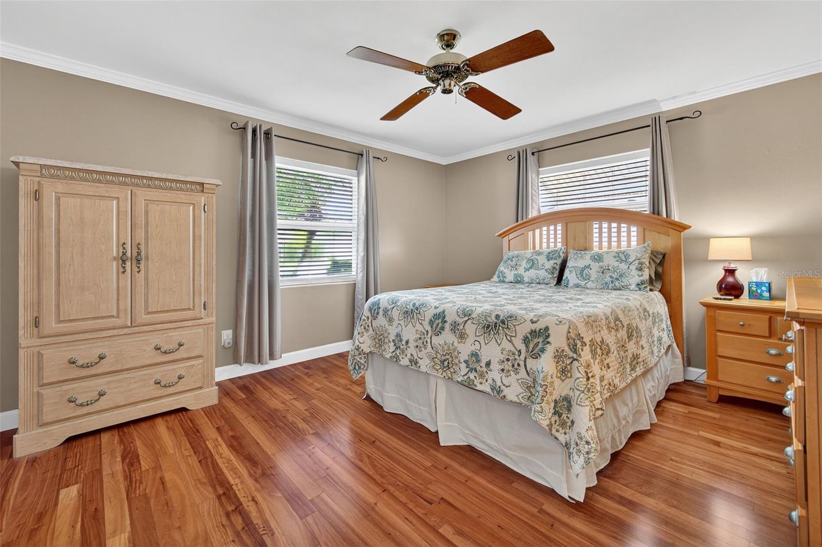 Master bedroom with beautiful Brazilian Cherry flooring! Both bedrooms have them!
