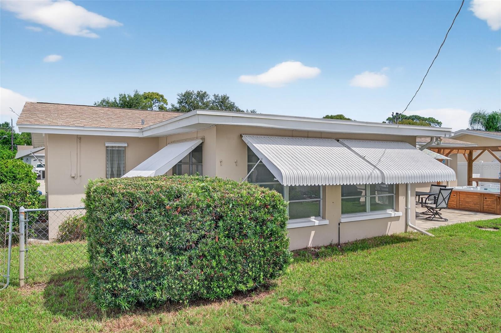 Back Florida room. Easily enclose the left corner for an additional patio or extra room.